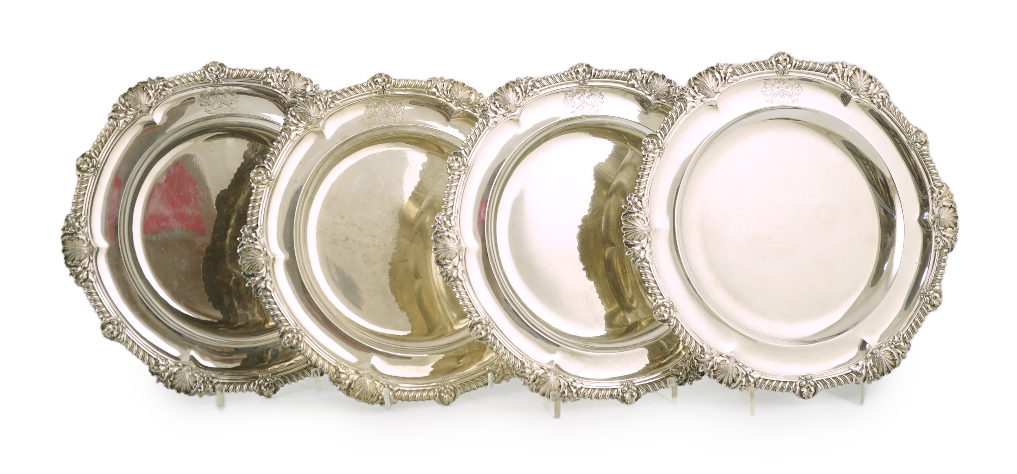 A set of four George IV silver dinner plates by Rundell, Bridge & Rundell